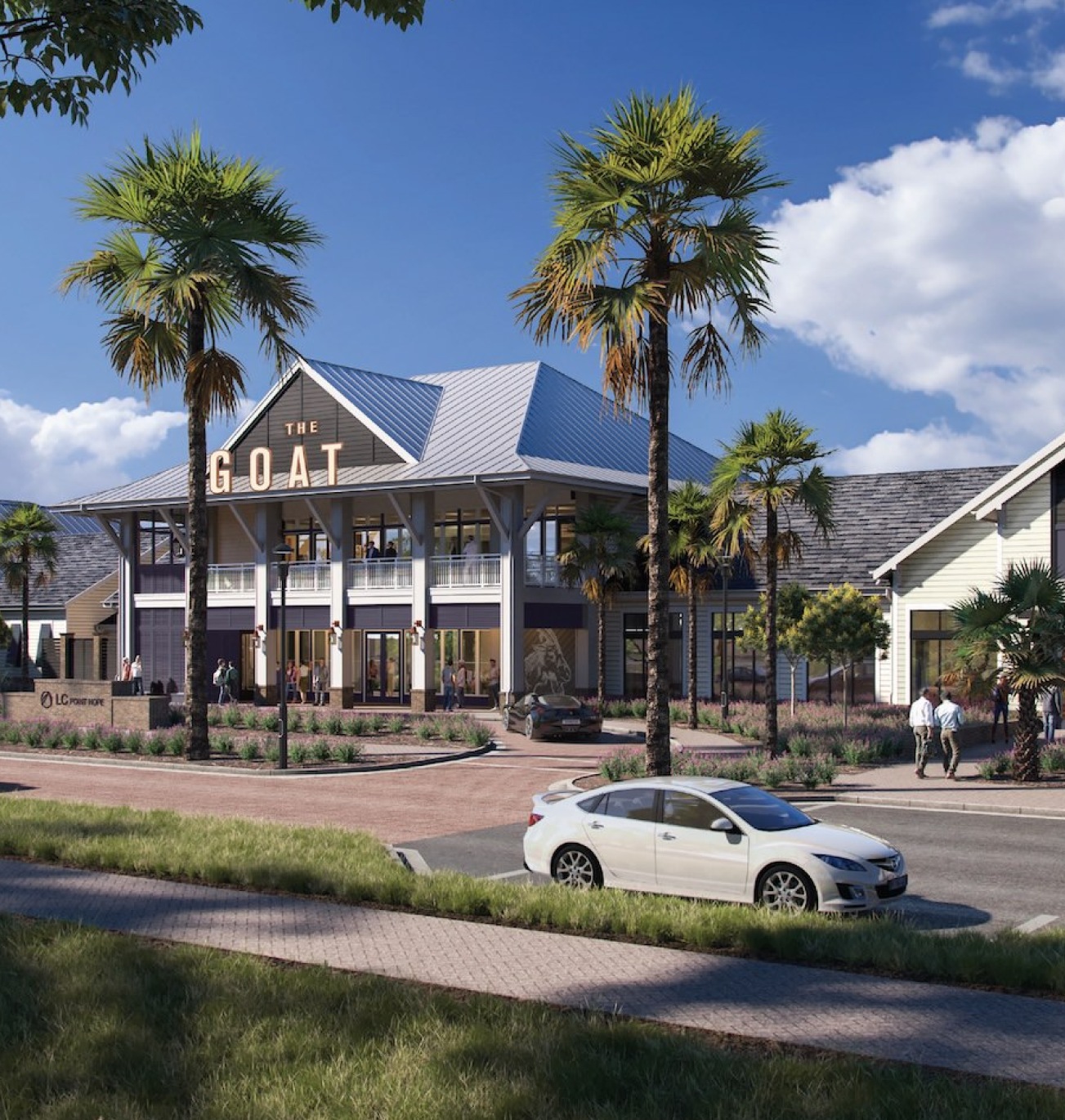 a street with cars  with palm trees and restaurants
